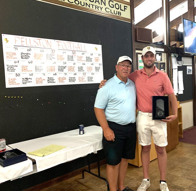 Canadian-born and current Ferris State University men's golfer Nathan Kraynyk, right, won the championship flight of the 74th Northern Michigan Open at the Cheboygan Golf & Country Club on Sunday. In this photo with Kraynyk is Cheboygan Golf & Country Club president Earl Parsons.