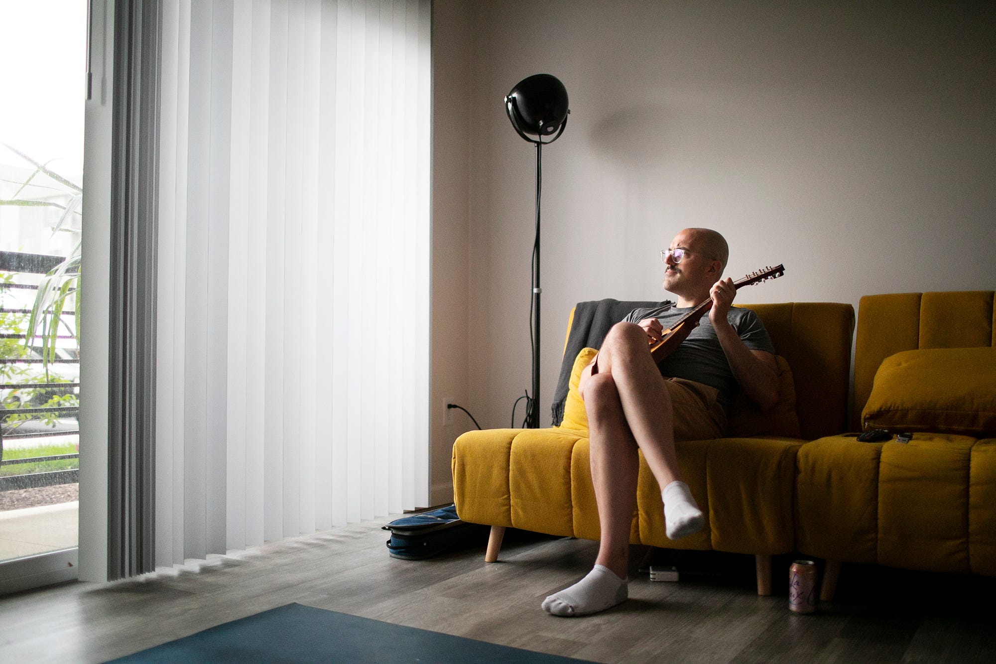 Chris Graham plays a mandolin at home in Westerville after an intense Eye Movement Desensitization and Reprocessing (EMDR) psychotherapy session. Therapy has helped Graham recover repressed memories of being raped by a Columbus priest when he was 14 years old.