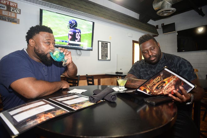 From left, Bernard Jean-Pierre, and Eddy Bien-Aime, at Southern Comfort Bar and Grill, 320 West Street Center Street, West Bridgewater, on Saturday, August 14, 2021.
