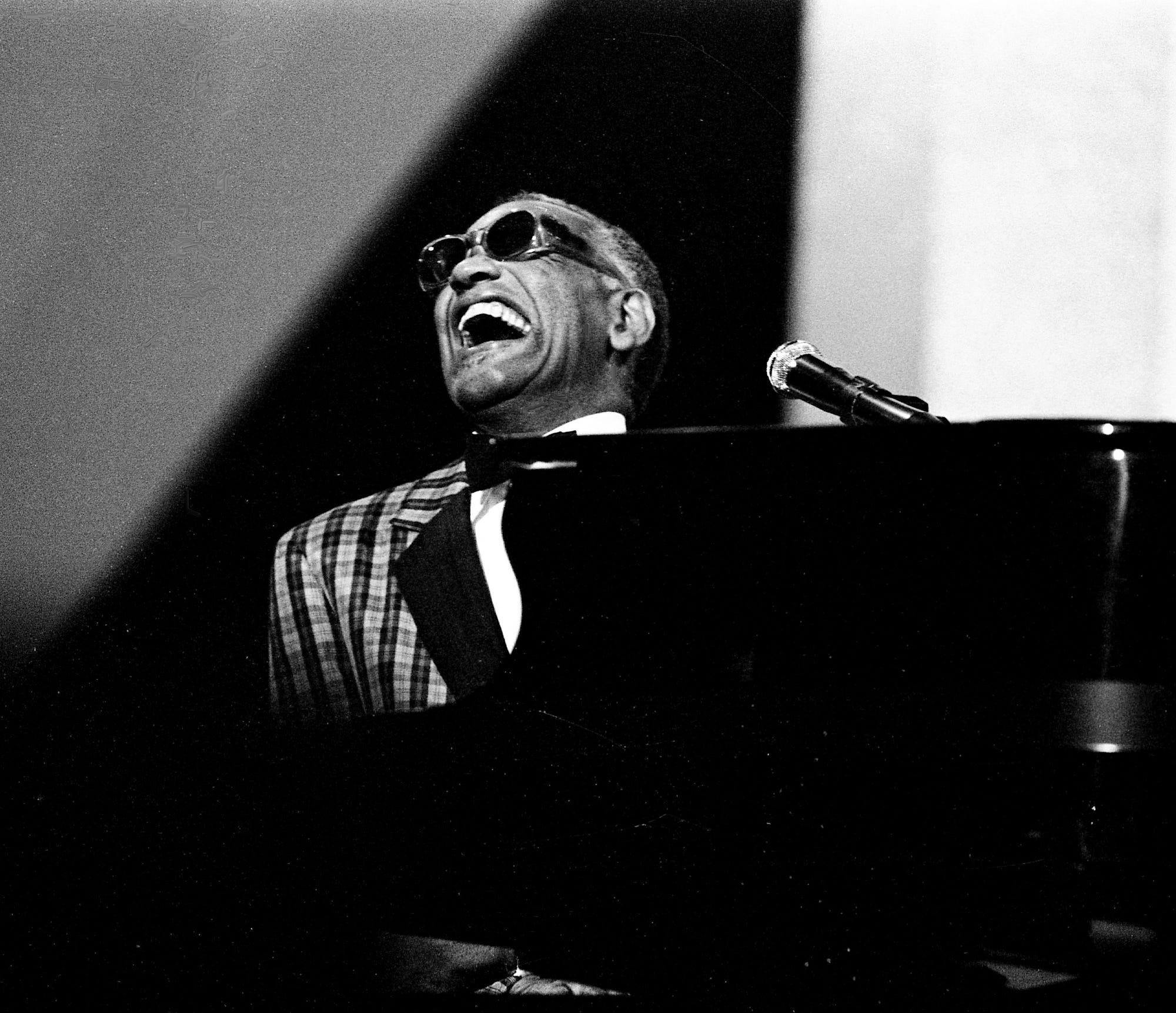 Legendary Ray Charles sways back and forth on his piano bench as he performs with a host of artists during the 18th annual CMA Awards show Oct. 8, 1984.