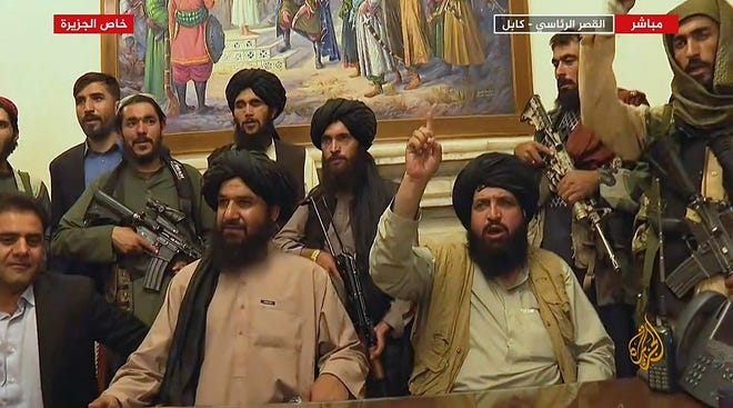 Members of the Taliban in the presidential palace in Kabul, Afghanistan on Aug. 16, 2021.