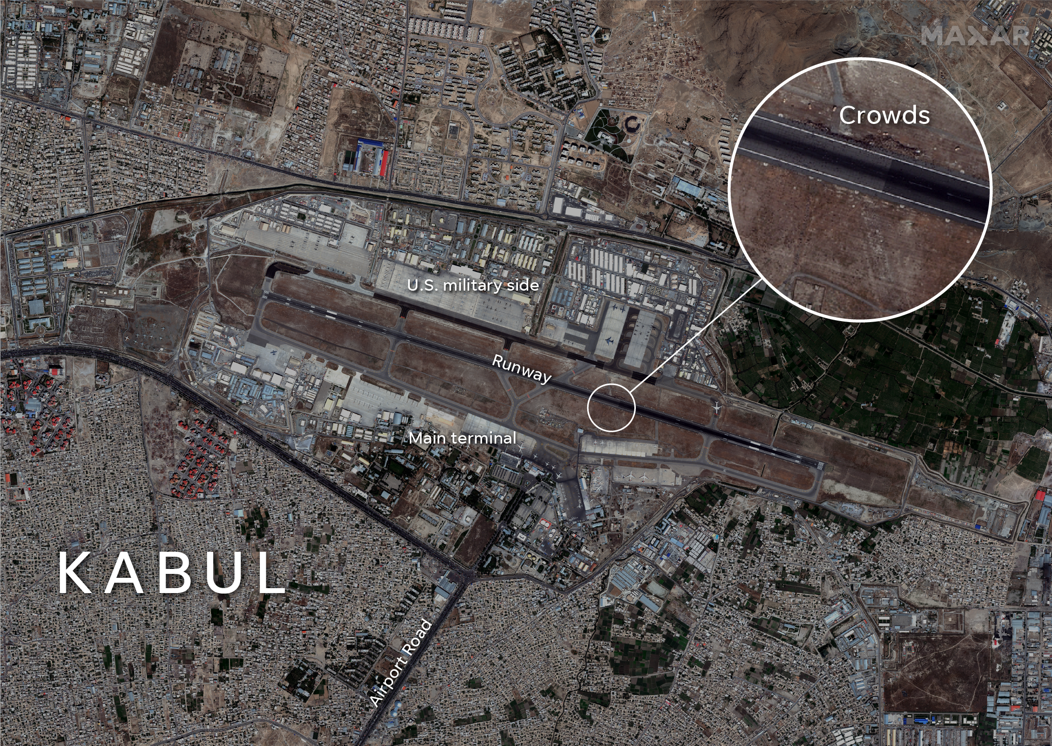 A satellite image of Hamid Karzai International Airport on Monday shows crowds of Afghans gathered on the runway.