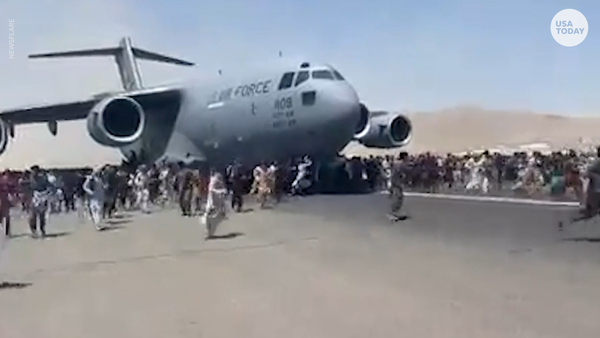 Afghans cling to U.S. plane as it leaves Kabul