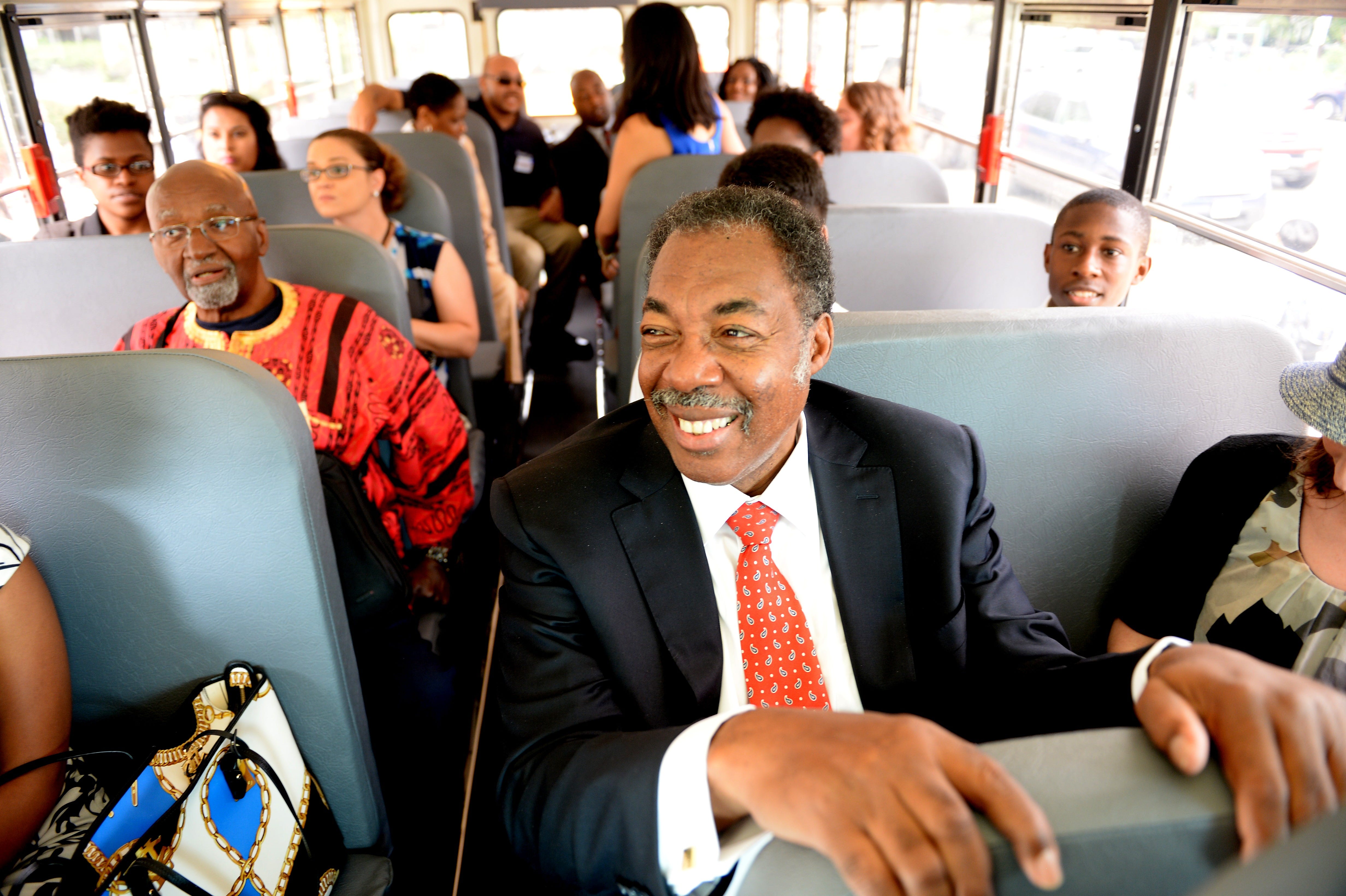 Freedom Rider Hank Thomas, front, sits on a bus for a ride to the Virginia State Capitol in Richmond after a ceremony marking the 50th anniversary of the Civil Rights Act at the Department of Education, July 2, 2014.