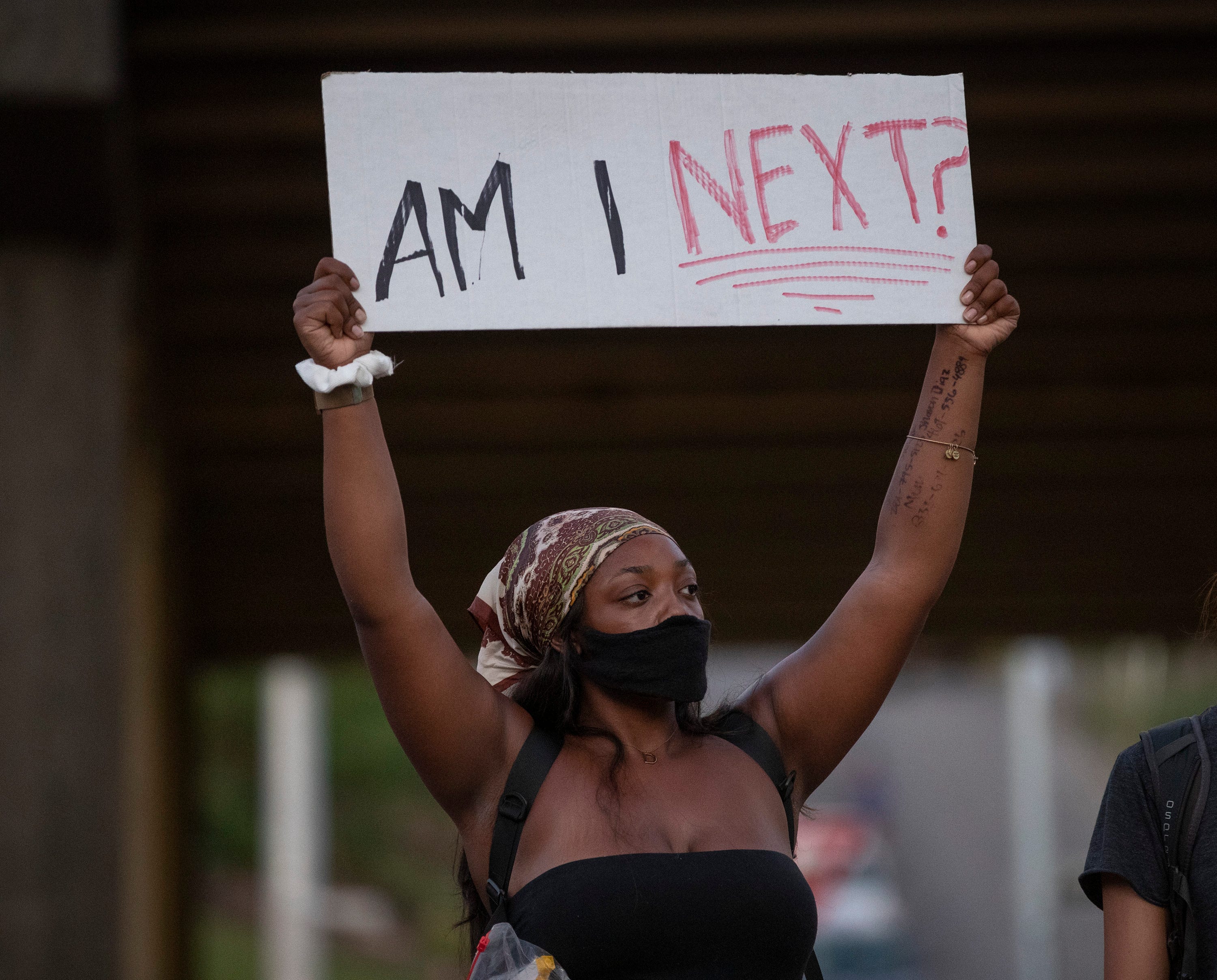 Denise Lyttle participates in a protest at the Austin Police Department Headquarters on Thursday June 4, 2020.  Hundreds of people gathered at the APD headquarters to protest the killing of George Floyd and Mike Ramos.