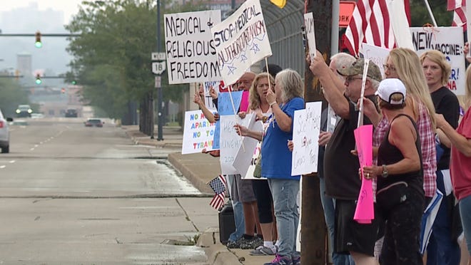 Protestors lined up outside Summa Health to protest the hospital's vaccine mandate.