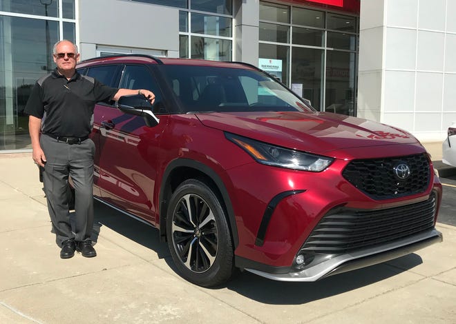 Tom Breeden, sales manager at Heart City Toyota in Elkhart, shows off a 2021 Toyota Highlander
