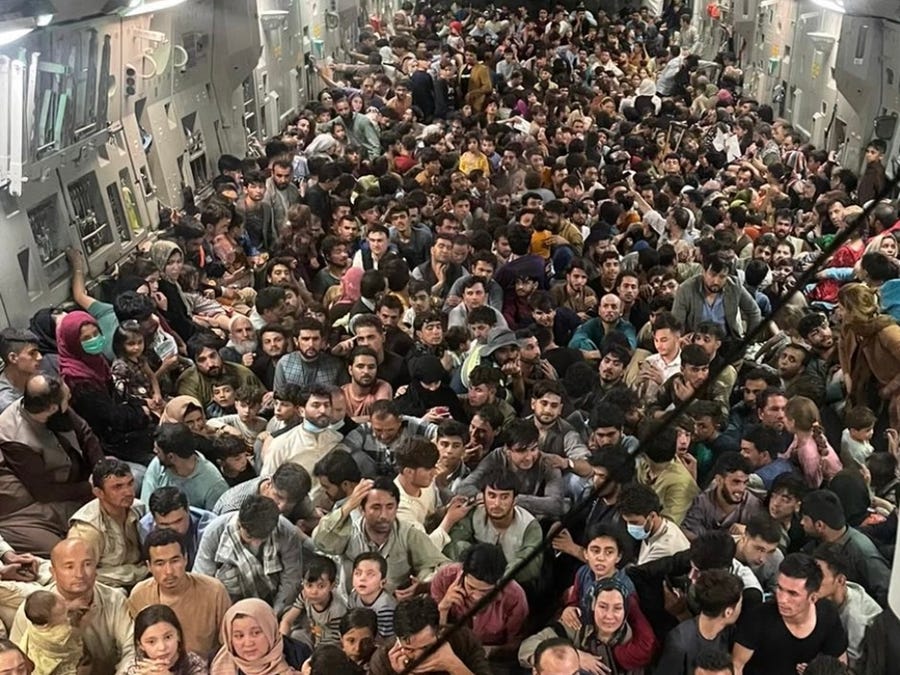 Almost 650 Afghan civilians are packed into Reach 871, a U.S. Air Force C-17 cargo plane flown from Kabul to Qatar on Aug. 15.