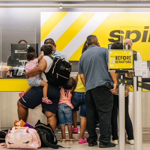 Spirit Airlines passengers check in at George Bush