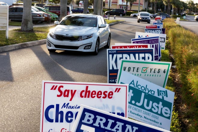 People drive in to vote at the Palm Beach County Supervisor of Elections office in West Palm Beach, Florida, November 6, 2018. [GREG LOVETT/palmbeachpost.com]