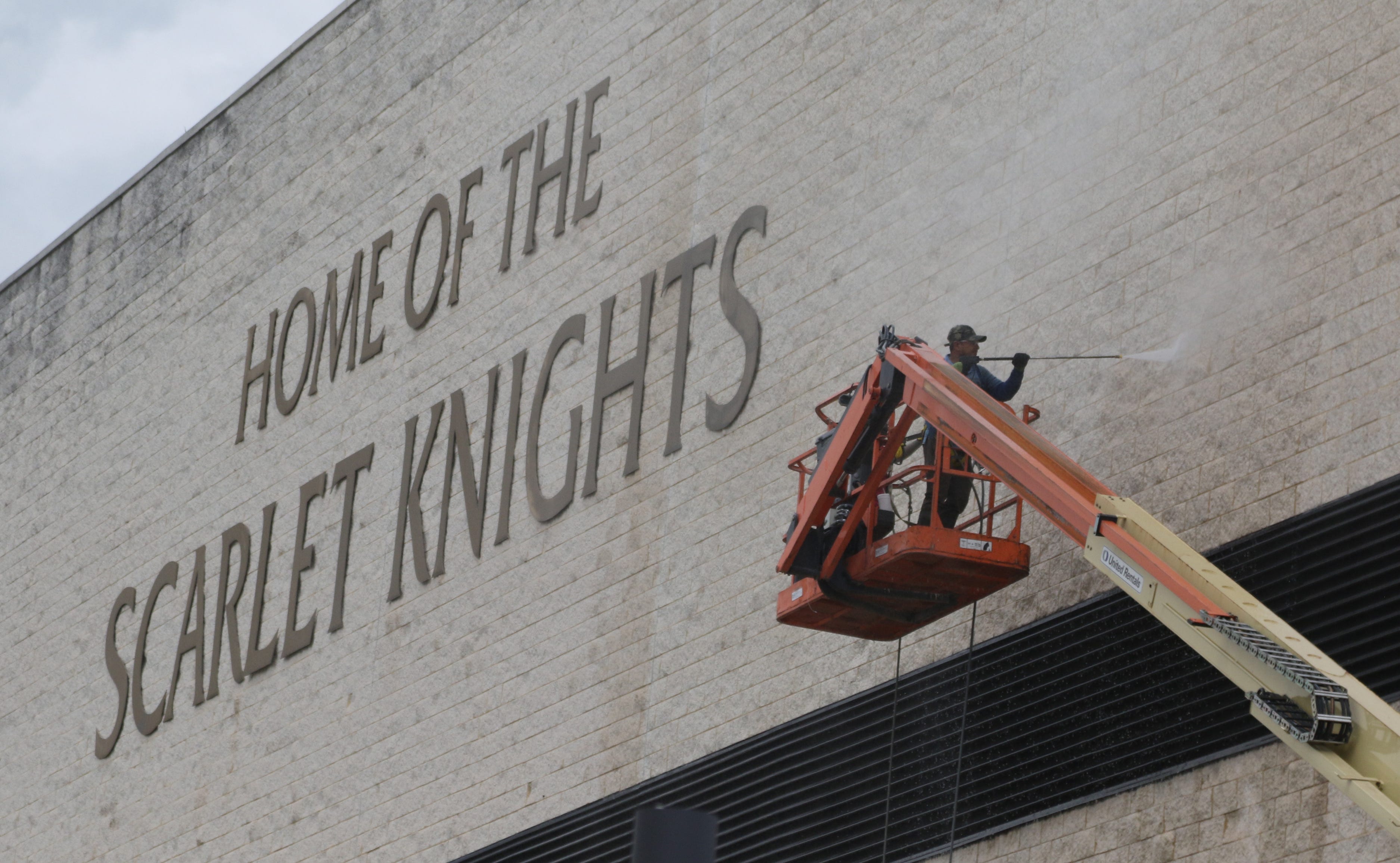 Cleaning the exterior of the Rutgers Athletic Center, one of the athletic department's older buildings as opposed to the two new athletic facilities on the campus of Rutgers University.