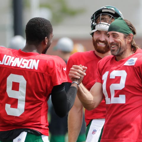 New York Jets quarterback Josh Johnson (9) greets 