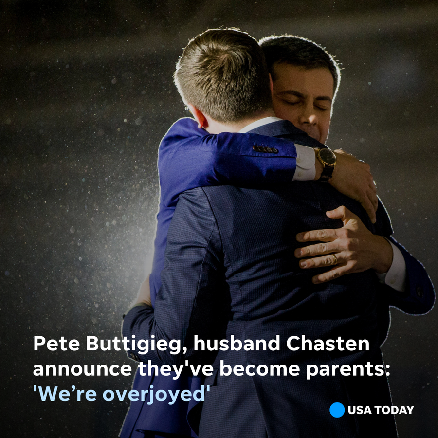 Former Democratic presidential hopeful Pete Buttigieg hugs his husband Chasten following his Iowa Caucus Watch Party event in Des Moines, Iowa, on Feb. 4, 2020.