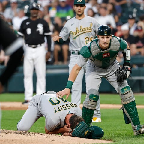 Oakland Athletics catcher Sean Murphy checks on st