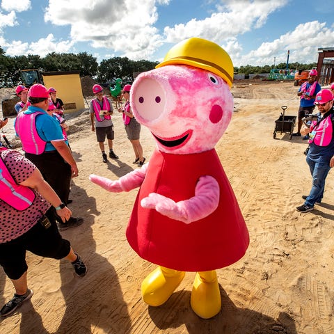 The Peppa Pig charachter poses for photos for medi
