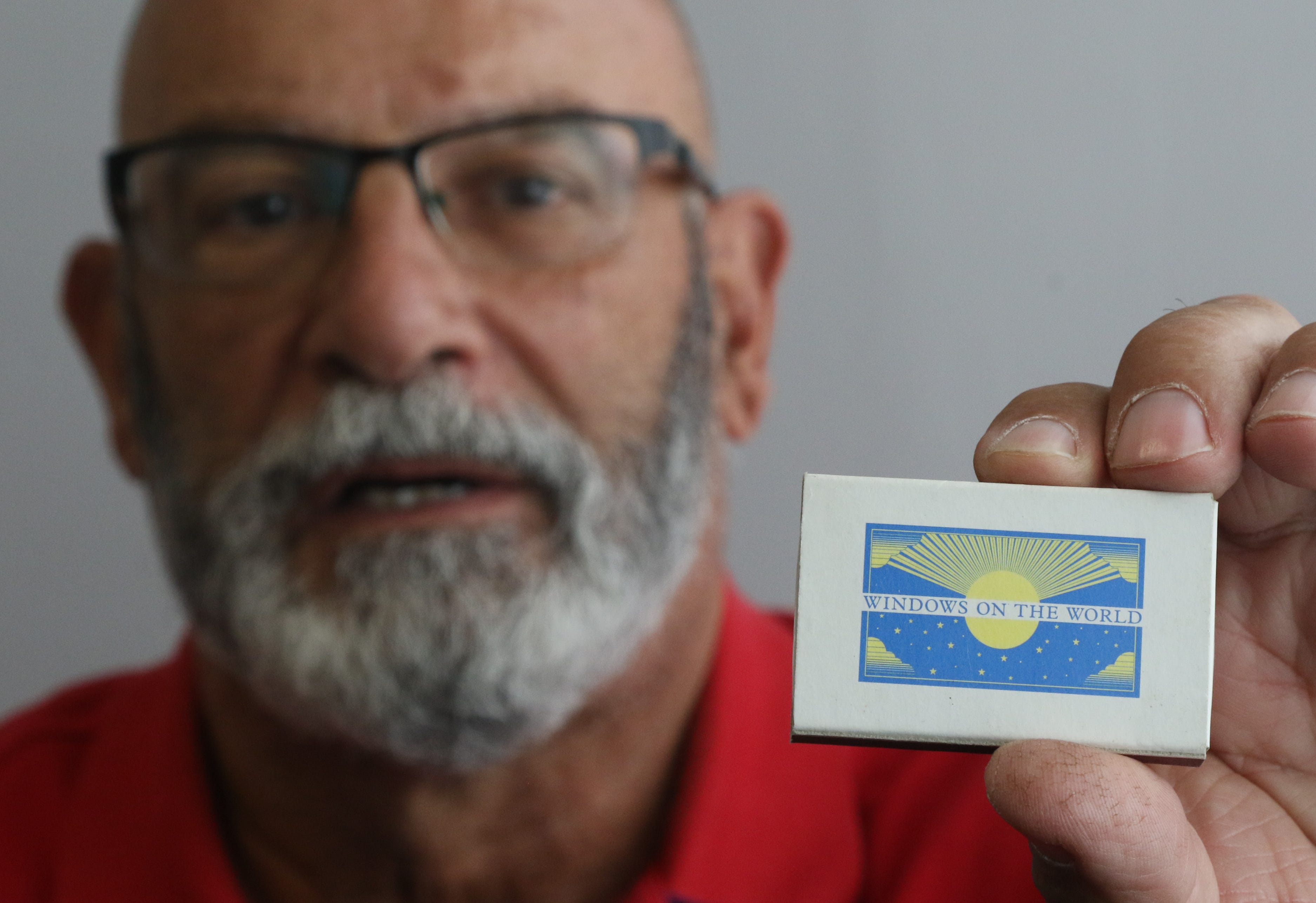 Luis Feglia holds a box of matches showing the logo of the restaurant Windows on the World. Feglia worked at Windows on the World in the World Trade Center in September 2001 but wasn’t in the building at the time of the attack on September 11. He now works in real estate on Long Island.