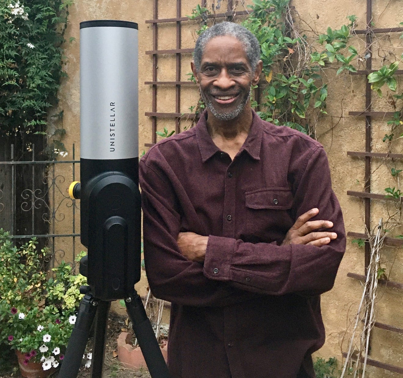 Tim Russ from Star Trek: Voyager poses with his backyard telescope