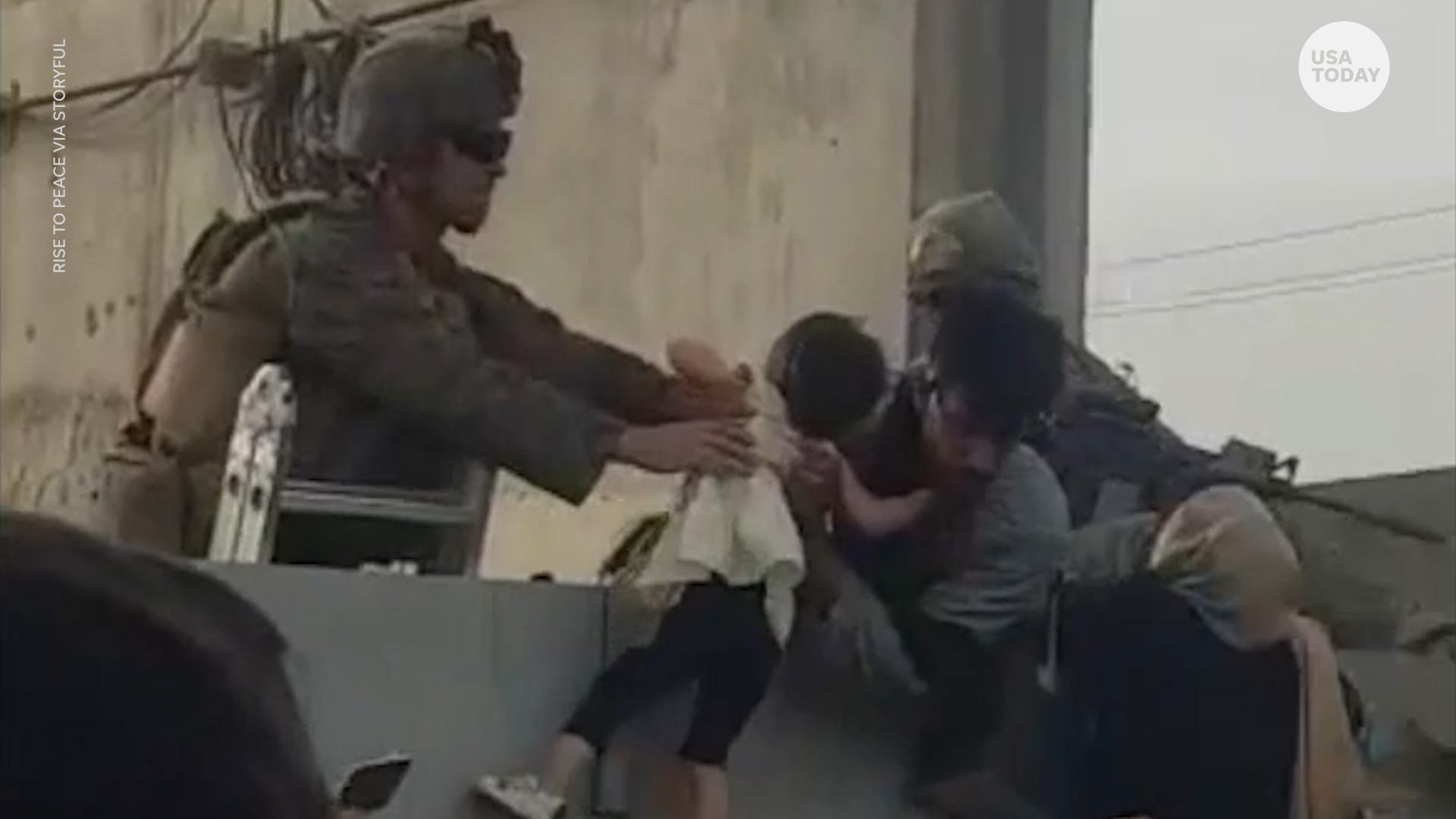 Child sleeps under US soldier's uniform, another passed over a wall: These are the kids fleeing Afghanistan thumbnail