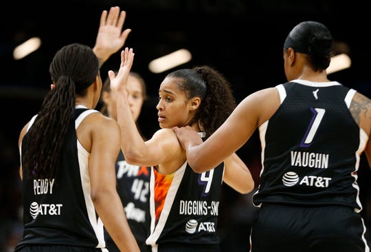 Phoenix Mercury's Skylar Diggins-Smith gets high fives from teammates during the second half of their game at Footprint Center Aug, 19, 2021 in Phoenix.