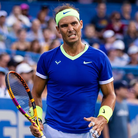Rafael Nadal reacts against Jack Sock during the C