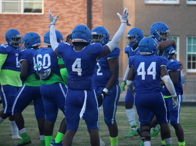 Riverside players including Devin Smith (4) and Gregory Washington (44) celebrate a touchdown run by Alvin Gibson (3, far right) just before halftime  during a high school football preseason kickoff classic against Bartram Trail on August 20, 2021. [Clayton Freeman/Florida Times-Union]