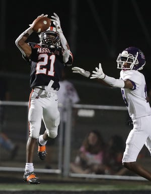 Massillon's Jaden Welch intercepts a pass intended for Pickerington Central's Derek Grimes in the second half at Paul Brown Tiger Stadium Friday, August 20, 2021.