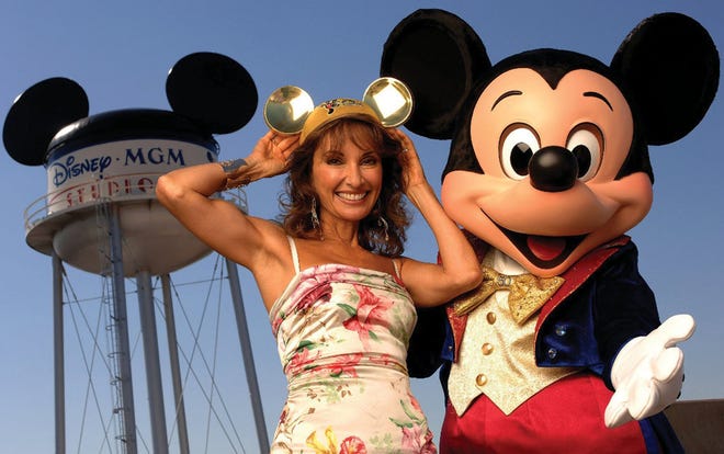 ABC Daytime Popular Melodrama Actress Susan Lucci "All My Children" Poses with Mickey Mouse to start the 10th ABC Super Soap Weekend at Disney's MGM Studios in November 2005.