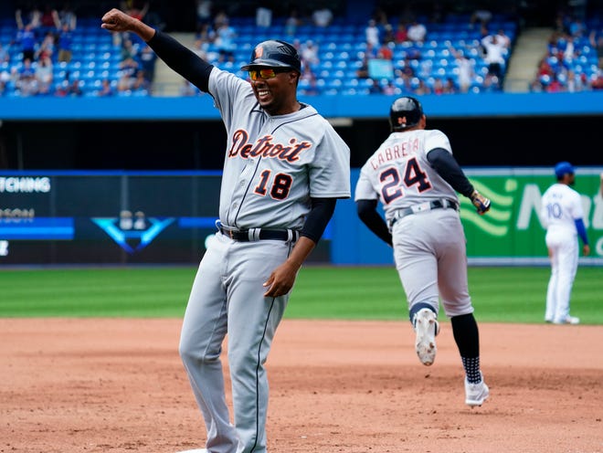 Detroit Tigers first base coach Kimera Bartee celebrates Miguel Cabrera's tying solo home run against the Toronto Blue Jays in the sixth inning at Rogers Centre. The home run was the 500th of his career on August 22, 2021.