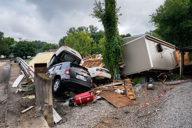 Flood damage is seen along Simpson Avenue in Waverly, Tennessee on Sunday, August 22, 2021. Fifteen inches of rain caused extensive flooding in the County town of Humphreys.