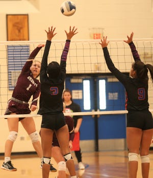 Bronte High School's Emily Jackson, far left, puts up a shot as San Angelo Central's Peyton Mayberry, 3, and Julia Morales go up for a block at the Nita Vannoy Memorial Volleyball Tournament in San Angelo on Saturday, Aug. 21, 2021.