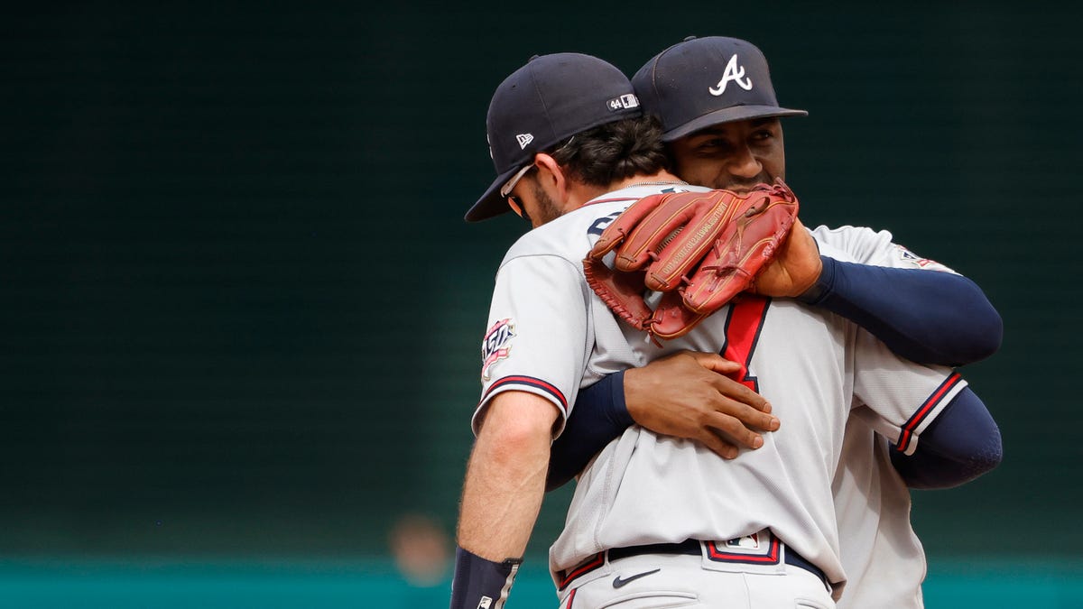 Ozzie Albies and Dansby Swanson celebrate a win against the Nationals.