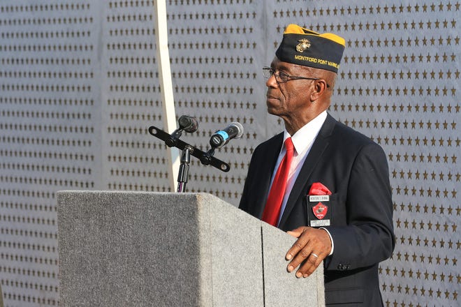 Retired U.S. Marine Corps CWO5 Houston Shinal speaks during the Montford Point Marine Day ceremony at Lejeune Memorial Gardens in Jacksonville, Aug. 22, 2019.