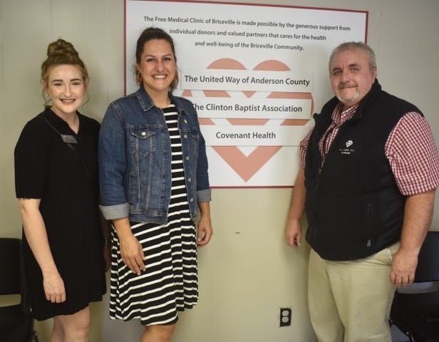 Amanda Brackett, from left, and Naomi Asher, both with the United Way of Anderson County, are pictured with Free Medical Clinic of Oak Ridge’s Billy Edmonds at the grand unveiling of the new Briceville Clinic on Sunday, Aug. 8, 2021.