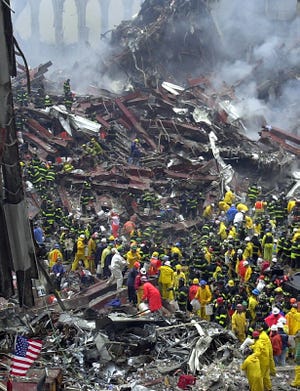 Hundreds of rescue workers searched the ruins of the World Trade Center on September 12, 2001 to find survivors. 