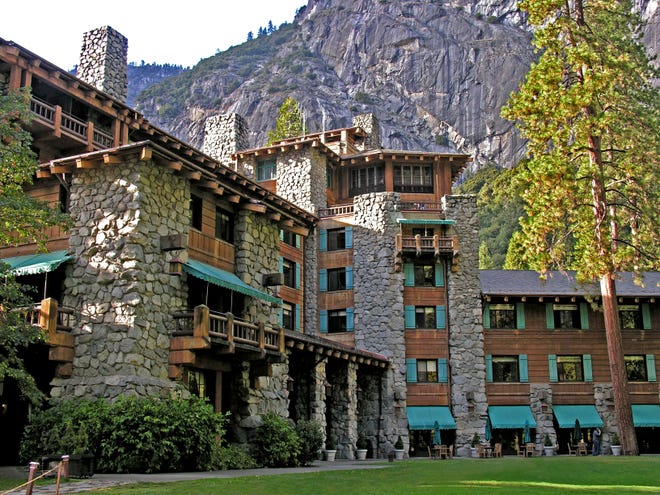Completed in 1927, the Ahwahnee Hotel at Yosemite National Park blends log-beamed ceilings, Native American artwork and a granite facade and massive stone hearths that echo the surrounding landscape.