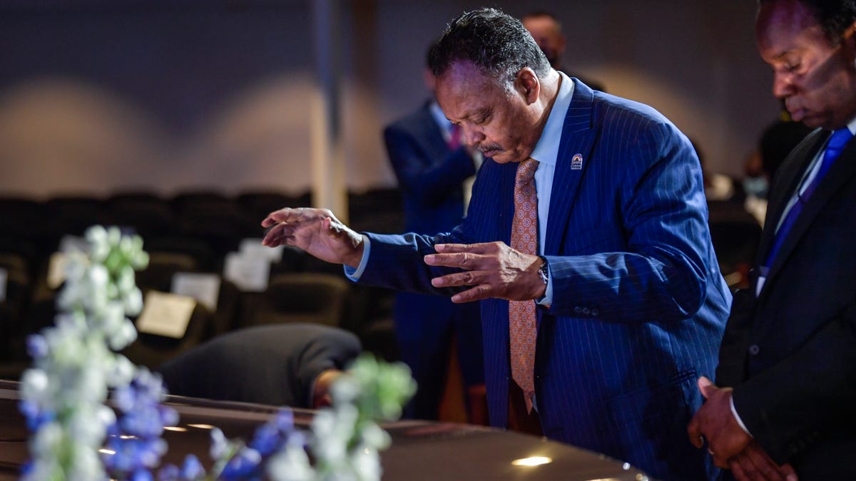 Civil rights leader Rev. Jesse Jackson pays respects over the casket of George Floyd prior to the start of the George Floyd family memorial service in the Frank J. Lindquist sanctuary at North Central University in Minneapolis, Minn. on June 4, 2020.