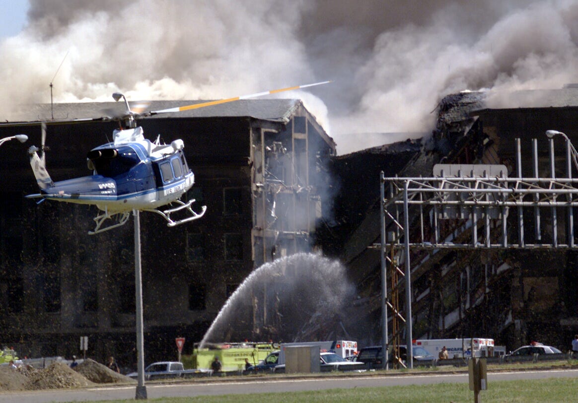 A U.S. Park Police helicopter arrives the Pentagon after picking up casualties of the plane crash in a terrorist attack.