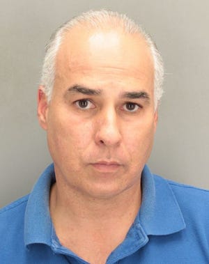 Alex Rodriguez, seen in a 2012 Miami-Dade County booking photo, received a $20,000 penalty by the Florida Commission on Ethics. The complaint against him was related to his involvement in a scheme to siphon votes from a Democratic candidate for the Florida Senate.