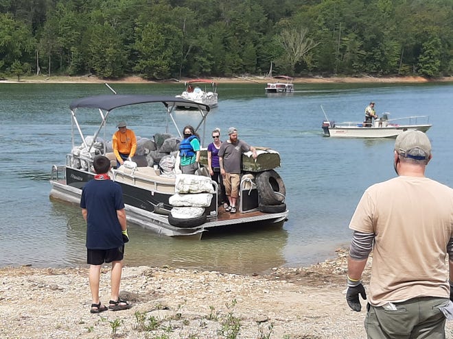 Volunteer help with a past Fall Five County Norris Lake Cleanup.