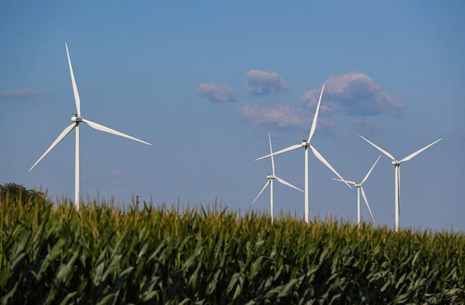 Wind turbines operate in a rural area north of Lafayette, Indiana, on Wednesday, August 4, 2021. 