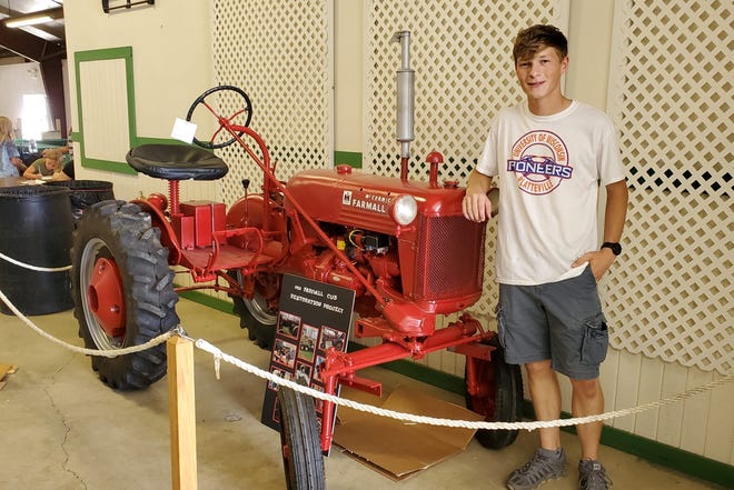 Waupun teen Cameron Pokorny restores Grandpa’s tractor for Dodge County Fair.
