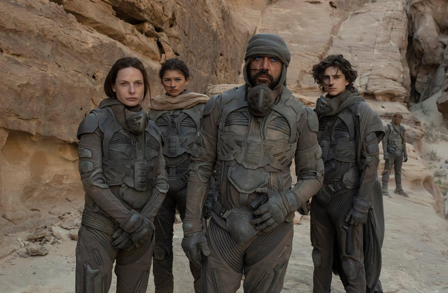 Rebecca Ferguson, from left, stars as Lady Jessica, Zendaya is Chani, Javier Bardem plays Stilgar and Timothée Chalamet is Paul Atreides in the sci-fi epic "Dune."