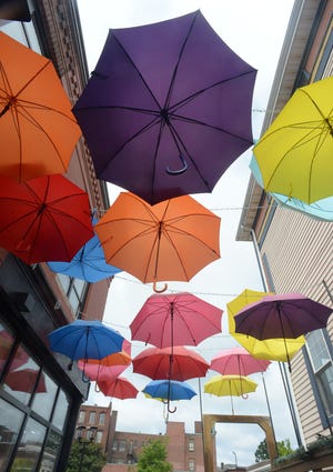 Colorful umbrellas decoration above the patio at Towne House Fall River/Douro Steakhouse  on Tuesday, August 25, 2021.