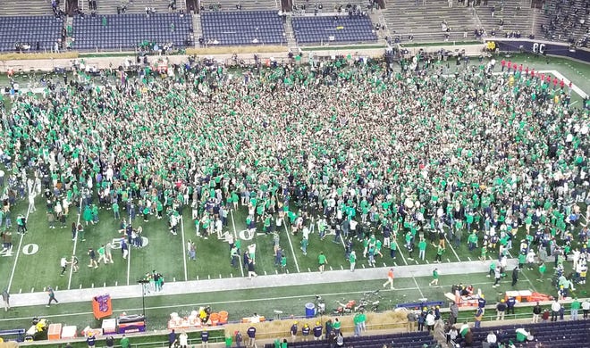 Notre Dame fans storm the field after the Irish upend No. 1 Clemson, 47-40 in overtime on Nov. 7, 2020, at Notre Dame Stadium.