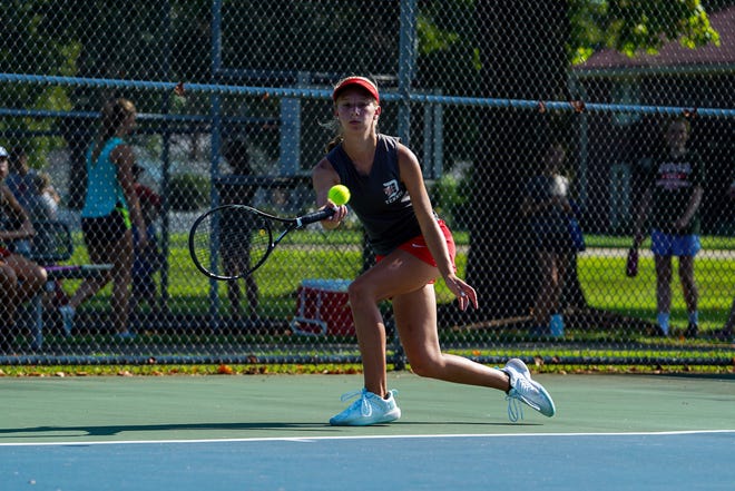 Dover's Taylor Rose lunges for the forehand volley at No. 1 singles last season.