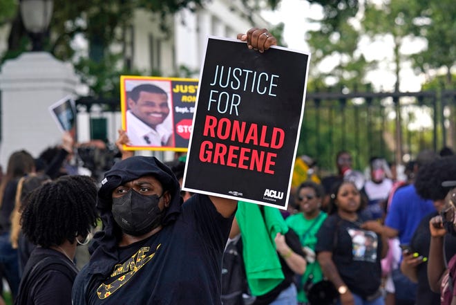 FILE - In this Thursday, May 27, 2021, file photo, demonstrators stand in front of the governor's mansion after a march from the state Capitol in Baton Rouge, La., protesting the death of Ronald Greene, who died in the custody of Louisiana State Police in 2019. (AP Photo/Gerald Herbert, File)