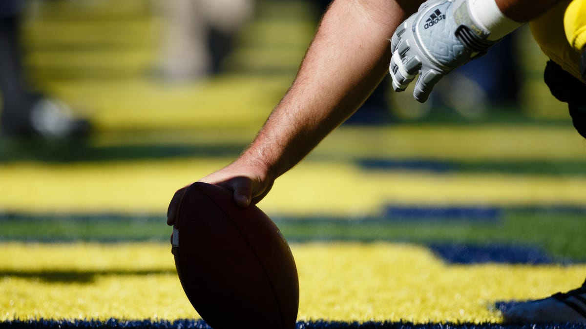 Detail shot of football about to be hiked before the game between the Michigan Wolverines and the Akron Zips at Michigan Stadium on Sept 14, 2013 in Ann Arbor, Mich.