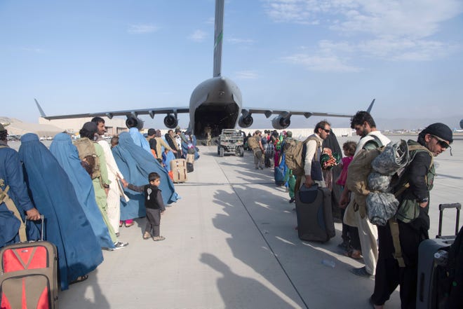 In this picture the U.S. Air Force load masters and U.S. Air Force pilots load the 816th Tuesday, August 24, 2021.