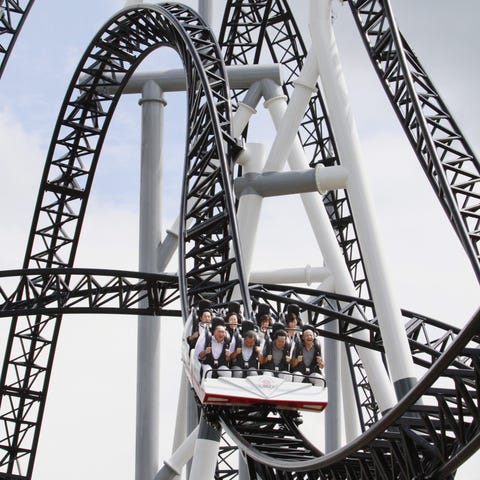 People react as they ride on Fuji-Q Highland amuse