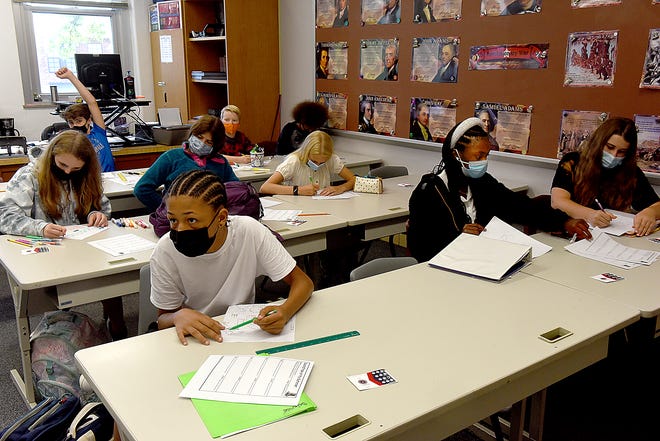 Students in Jefferson Middle School teacher Brett Hecker’s social studies class wear masks while studying Aug. 26.